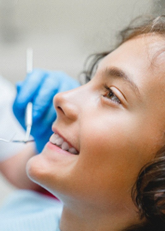 A smiling boy at the dentist