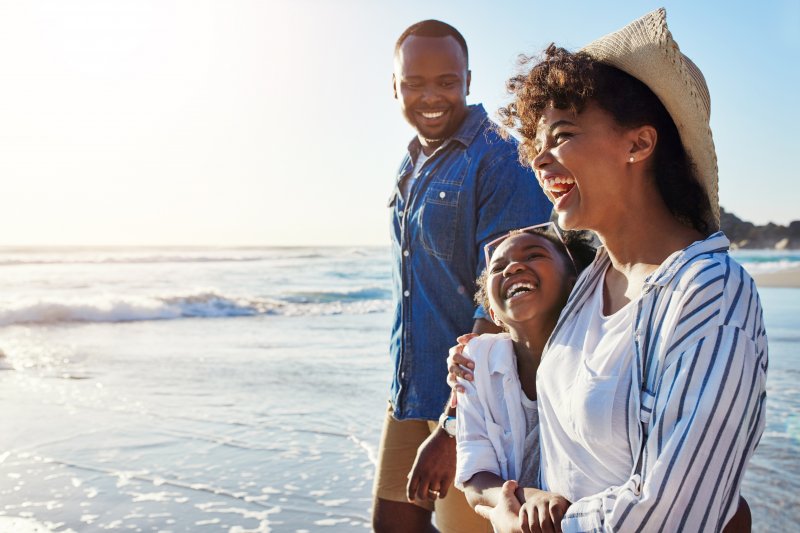 Patient smiling on vacation after dental checkup
