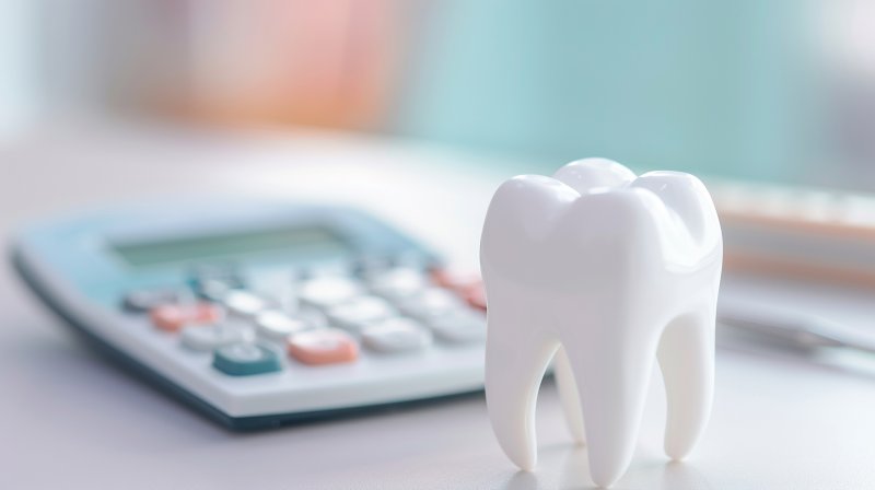 a calculator and a fake tooth 