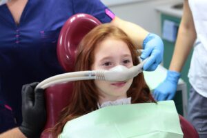 Child receiving laughing gas